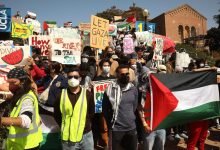 Photo of Police mass near UCLA pro-Palestinian protest camp, a day after violent clashes