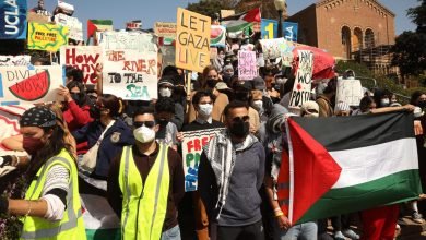 Photo of Police mass near UCLA pro-Palestinian protest camp, a day after violent clashes